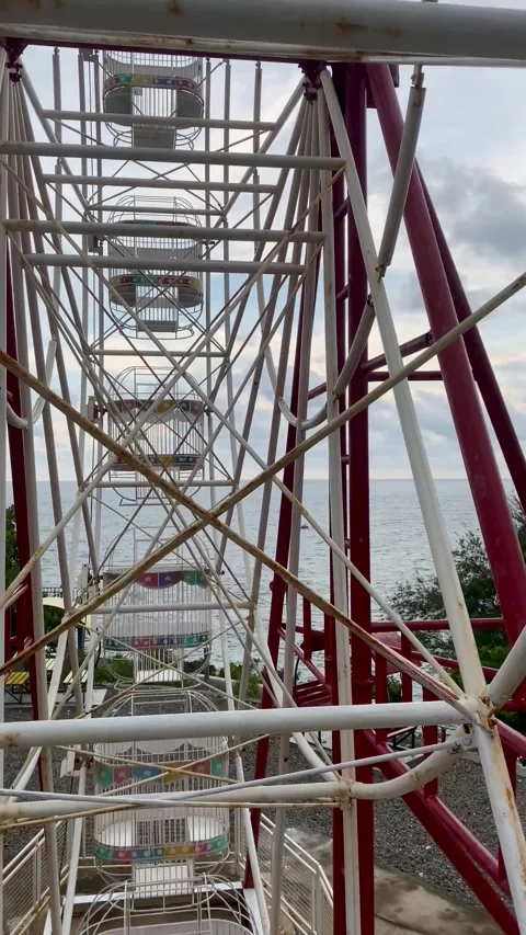4K POV View from Ferris Wheel Overlooking the Sea Coastline Stock Footage 329870176
