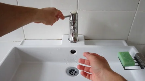 4K POV view of man washing hands in hospital bashroom. Coronavirus prevention Stock Footage 129832151