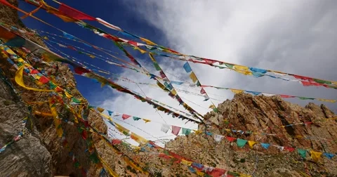 4k Prayer flags at the lake namtso in tibet,ancient monk meditation in cave. Stock Footage 45581908