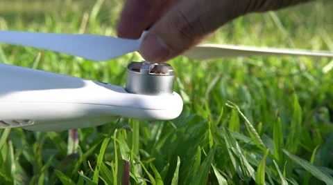 4K Preparing The Drone Helicopter For Takeoff in a Park. Beautiful sun day -Dan Stock Footage