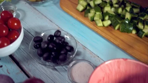 4k, Preparing fresh vegetable salad with greek cheese. Food stop motion animatio Stock Footage 99572199