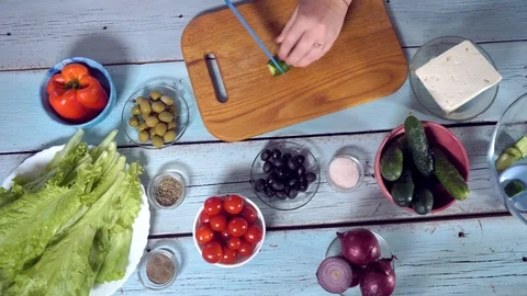 4k, Preparing fresh vegetable salad with greek cheese. Food stop motion animatio Stock Footage 99572224