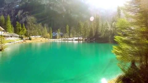 4K Pristine Turquoise Lake Evergreen Forest and Snow Dusted Mountains Video stock 332156964