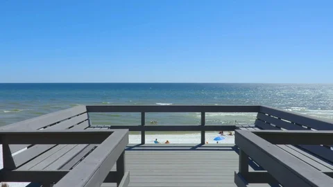 4K Private Beach Patio Looking Down on White Sandy Ocean Beach Stock Footage 107999540
