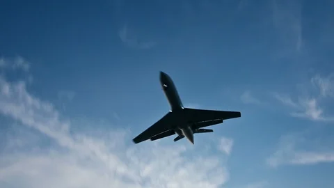 4K Private jet airplane approaching landing with ocean view Stock Footage 105656629