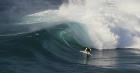 4K of pro surfer David Langer riding big waves of Atlantic ocean on surfboard Stock Footage 163086070