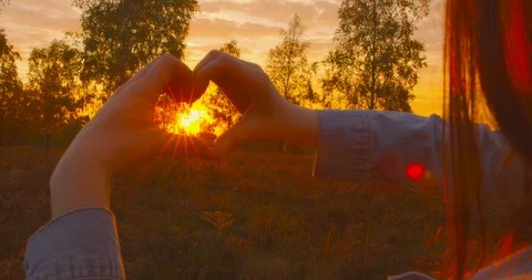 4k - Pro Wind Power, Pro Nature - Beautiful young woman forming a heart shape 스톡 동영상 98045761