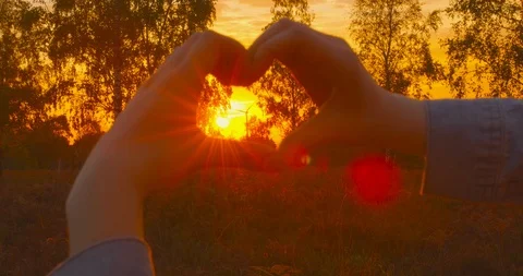 4k - Pro Wind Power, Pro Nature - Beautiful young woman forming a heart shape Stock-Footage 98046224