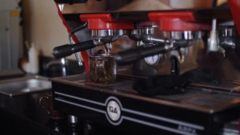 4k the process of making espresso preparing cups of coffeef in a busy coffee Видео 111328403