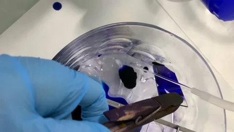 4k Process of washing out the excessive dye on cell sample Stock Footage 135950283