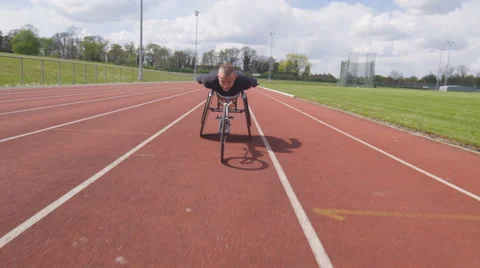 4K Professional disabled athlete training alone at race track Stock Footage