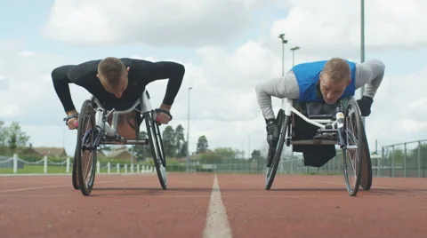 4K Professional disabled athletes training together at race track.  Stock Footage 64591313