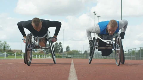 4K Professional disabled athletes training together at race track.  Stock Footage 64591531