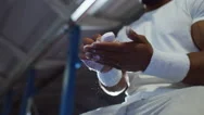4K Professional Male Gymnast Chalking His Hands In Preparation For Training Stock Footage