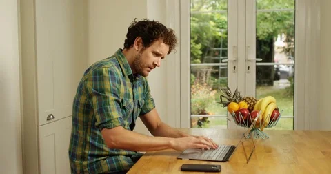 4K Professional man working from home, dealing with a business issue over phone Video stock 80476877