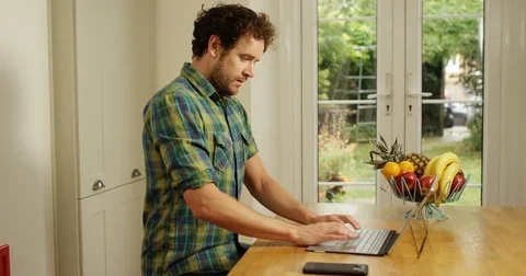 4K Professional man working from home dealing with a business problem over phone Video stock 80477488