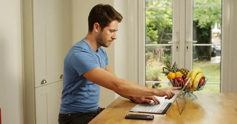 4K Professional man working from home, dealing with a business issue over phone Video stock 80627190