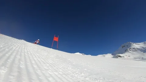 4K professional ski racer skiing one turn of giant slalom Stock Footage 105148413