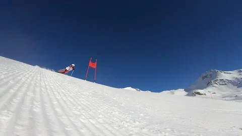 4K professional ski racer skiing giant slalom Stock Footage 115969825