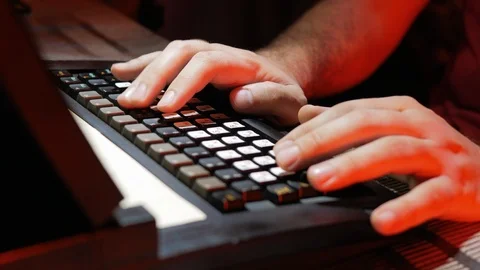 4k Programmer male works at dark room soft developing with red background light  스톡 동영상 87183947
