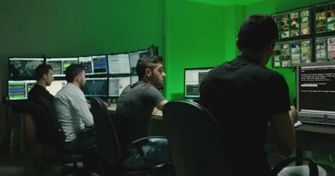 4K Programmers using many laptops computers  following information, statistics . Stock Footage 163545621