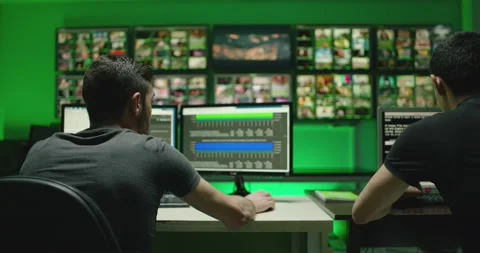 4K Programmers using many laptops computers  following information, statistics . Stock Footage 163545835