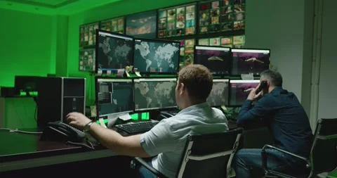 4K Programmers using many laptops computers  following information, statistics . Stock Footage 163546138