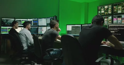 4K Programmers using many laptops computers  following information, statistics . Stock Footage 163546229