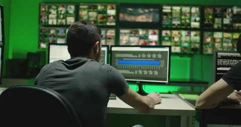 4K Programmers using many laptops computers  following information, statistics . Stock Footage 163546262