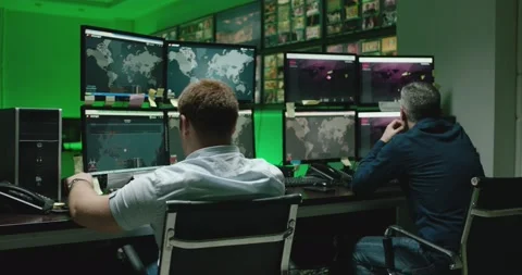 4K Programmers using many laptops computers  following information, statistics . Stock Footage 163546463