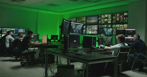 4K Programmers using many laptops computers  following information, statistics . Stock Footage 163546564