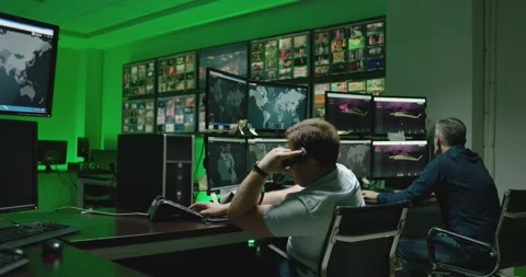4K Programmers using many laptops computers  following information, statistics . Stock Footage 163546571
