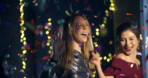 4k ProRes 422. Two young women celebrates dance the new year, Christmas, holiday Stock Footage 161057892