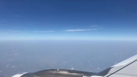 4K public air plane wing on blue sky with beautiful cloudy on morning Stock Footage 88773602