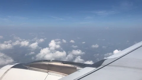 4K public air plane wing on blue sky with beautiful cloudy on morning Stock Footage 88774178