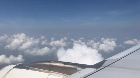 4K public air plane wing on blue sky with beautiful cloudy on morning 動画素材 88774411