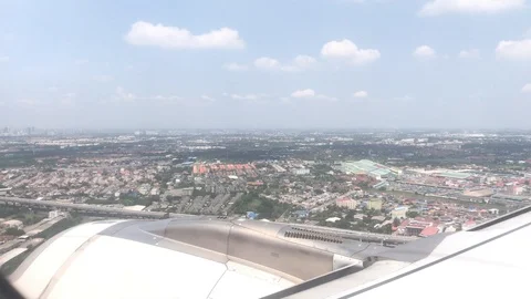 4K public air plane wing on blue sky with beautiful cloudy on morning Stockbeeldmateriaal 88774657