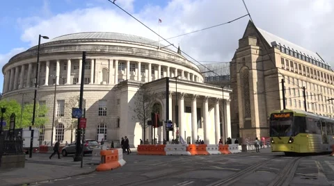 4K Public library building tram traffic pedestrian people cross road Manchester Stock Footage 60064709