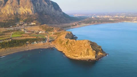4K Pull-back Aerial View of Sanbansan and Yongmeori Coast, Jeju Volcanic Island. Stock Footage 146068084