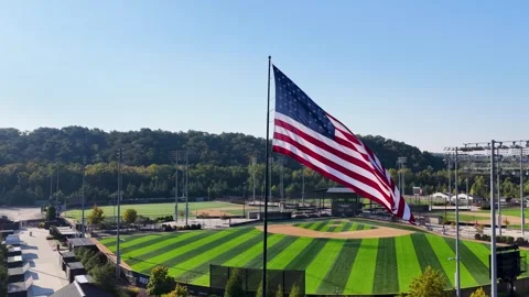 4K Pull Back drone footage of America Flag at LakePoint Sports' Baseball Village Stock Footage 346904323