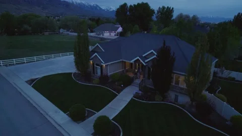 4K Pull Out Dusk Footage of Upper Middle Class Ranch Home at Base of Rockies Stock Footage 154050031