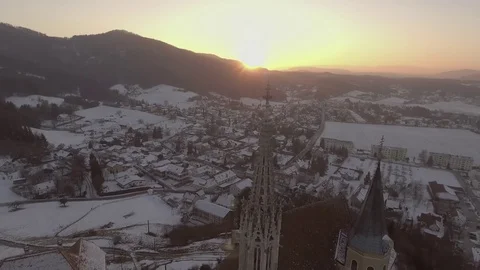 4K, Pullback shot of colorful winter sunset with idyllic village in the valley Stock Footage 73100911