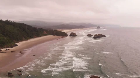 4K Pulling Back From Cannon Beach and Ecola State Park Aerial Stock Footage 111112969
