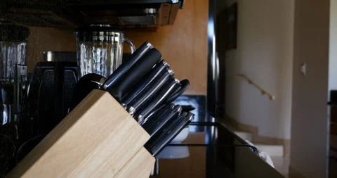 4K Pulling Chef knife from knife block Stock Footage 100093936