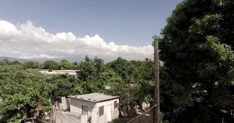 4K Push and Pull at Low Altitude Aerial of NEighborhood in Jamaica- RAW Color Stock Footage 70175424
