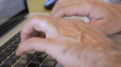4k Push-in of a hand typing on a laptop and then moving to a computer mouse Stock Footage 60953741