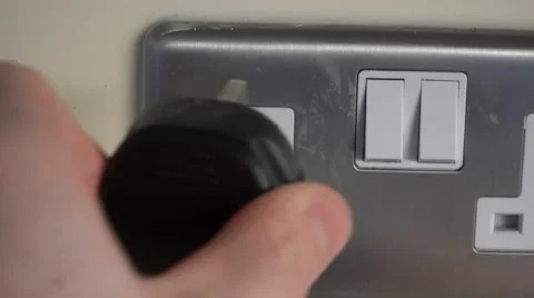 4k putting plug in a socket and switching it on, UK electrical sockets Stock Footage 47807600