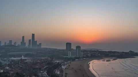 4K Qingdao Beach Overlooking CBD Buildings Sunrise Time Lapse Stock Footage 346940647