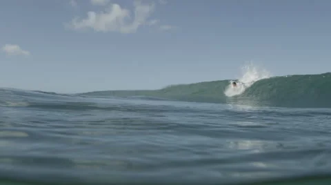 4K R3D - Slow mo Surfer on wave with underwater view Stock Footage 58668678