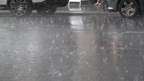 4K. Rain on the asphalt. It is raining heavily on street. Car traffic-Adrian Stock Footage 95726906